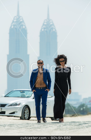 To use this stock image in your creative project, please select the size you need over to the right and click the "Add to Cart" button.
Your downloaded image will come with the Cutcaster watermark removed so don’t worry about the watermark you see on this page. Couple on the background of skyscrapers stock photo, Lovable couple came out of the white car. A walk on a deserted beach in Dubai on the background of skyscrapers. The dark-haired woman in high heels with a fluffy head of hair in a black dress. A tall by bezikus