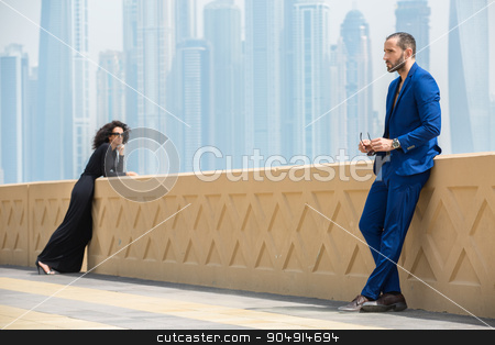 To use this stock image in your creative project, please select the size you need over to the right and click the "Add to Cart" button.
Your downloaded image will come with the Cutcaster watermark removed so don’t worry about the watermark you see on this page. Couple on the background of skyscrapers stock photo, Elegant couple on the terrace with views of the skyscrapers in Dubai. The man in the blue suit. The dark-haired girl in a long black dress. UAE by bezikus