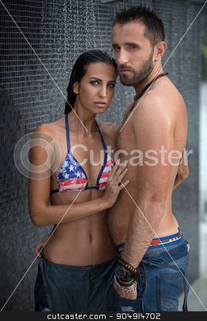 To use this stock image in your creative project, please select the size you need over to the right and click the "Add to Cart" button.
Your downloaded image will come with the Cutcaster watermark removed so don’t worry about the watermark you see on this page. Couple in the shower stock photo, Daring couple relaxing in the shower wearing jeans outdoors. The dark-haired girl in a bathing suit. Tropics. Vertical photo by bezikus