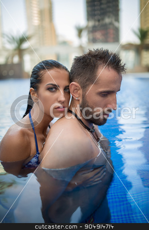 To use this stock image in your creative project, please select the size you need over to the right and click the "Add to Cart" button.
Your downloaded image will come with the Cutcaster watermark removed so don’t worry about the watermark you see on this page. Couple in the pool stock photo, Young couple basking in the crystal clear outdoor swimming pool. Girl in swimsuit. Tropics. Vertical photo by bezikus