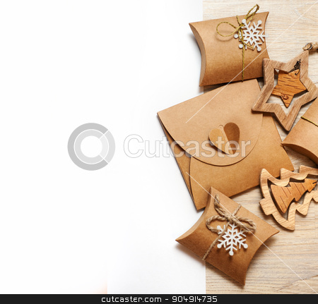To use this stock image in your creative project, please select the size you need over to the right and click the "Add to Cart" button.
Your downloaded image will come with the Cutcaster watermark removed so don’t worry about the watermark you see on this page. handmade wooden toys and Christmas boxes for gifts of kraft paper stock photo, handmade wooden toys and Christmas boxes for gifts of kraft paper. by timonko