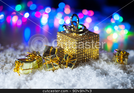 To use this stock image in your creative project, please select the size you need over to the right and click the "Add to Cart" button.
Your downloaded image will come with the Cutcaster watermark removed so don’t worry about the watermark you see on this page. Christmas present in gold wrapping with ribbon on winter background stock photo, Christmas present in gold wrapping with ribbon on winter background. by timonko