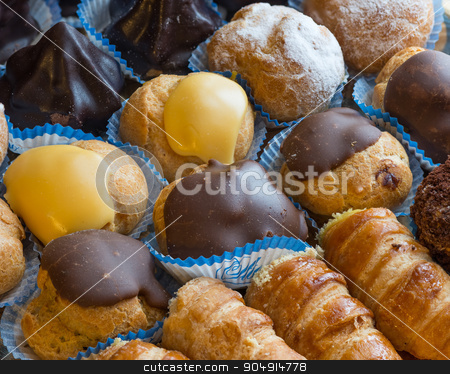 To use this stock image in your creative project, please select the size you need over to the right and click the "Add to Cart" button.
Your downloaded image will come with the Cutcaster watermark removed so don’t worry about the watermark you see on this page. diversity pastries from above stock photo, In the pictured colorful pastries with candied,cream and chocolate from above,the real Italian confectionery. by Robertobinetti70