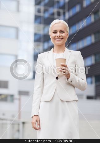 To use this stock image in your creative project, please select the size you need over to the right and click the "Add to Cart" button.
Your downloaded image will come with the Cutcaster watermark removed so don’t worry about the watermark you see on this page. smiling businesswoman with paper cup outdoors stock photo, business, hot drinks and people and concept - young smiling businesswoman with paper coffee cup over office building by Syda Productions