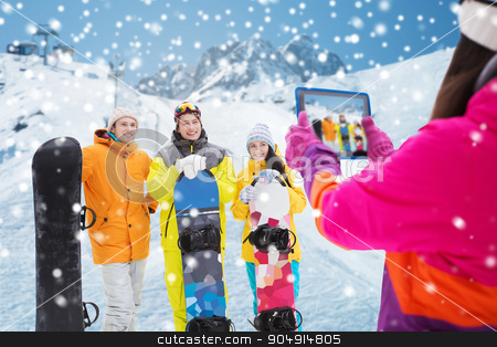 To use this stock image in your creative project, please select the size you need over to the right and click the "Add to Cart" button.
Your downloaded image will come with the Cutcaster watermark removed so don’t worry about the watermark you see on this page. happy friends with snowboards and tablet pc stock photo, winter sport, technology, leisure, friendship and people concept - happy friends with snowboards and tablet pc computer taking picture over snow and mountain background by Syda Productions