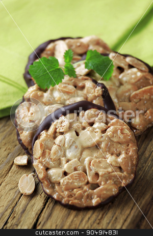 To use this stock image in your creative project, please select the size you need over to the right and click the "Add to Cart" button.
Your downloaded image will come with the Cutcaster watermark removed so don’t worry about the watermark you see on this page. Nutty cookies stock photo, Nut Florentine cookies with a layer of chocolate on one side by Digifoodstock