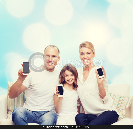To use this stock image in your creative project, please select the size you need over to the right and click the "Add to Cart" button.
Your downloaded image will come with the Cutcaster watermark removed so don’t worry about the watermark you see on this page. happy family with smartphones stock photo, holidays, technology, advertisement and people concept - smiling family with smartphones over blue lights background by Syda Productions