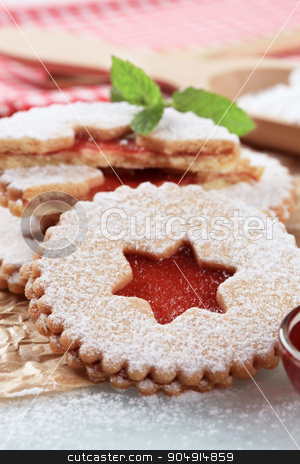 To use this stock image in your creative project, please select the size you need over to the right and click the "Add to Cart" button.
Your downloaded image will come with the Cutcaster watermark removed so don’t worry about the watermark you see on this page. Jam shortbread cookies stock photo, Christmas shortbread cookies with jam filling - detail by Digifoodstock