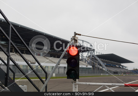 To use this stock image in your creative project, please select the size you need over to the right and click the "Add to Cart" button.
Your downloaded image will come with the Cutcaster watermark removed so don’t worry about the watermark you see on this page. red traffic lights and road sign on race track stock photo, motosports, extreme and race concept - close up of red traffic lights and road sign with flag on speedway track or road by Syda Productions