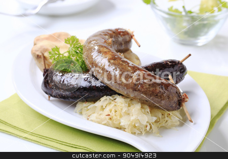 To use this stock image in your creative project, please select the size you need over to the right and click the "Add to Cart" button.
Your downloaded image will come with the Cutcaster watermark removed so don’t worry about the watermark you see on this page. Blood sausage and white pudding with sauerkraut stock photo, Blood sausage and white pudding with sauerkraut and baked potato by Digifoodstock