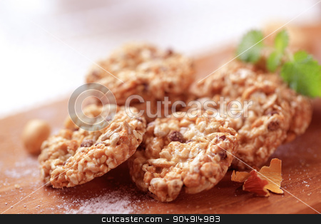 To use this stock image in your creative project, please select the size you need over to the right and click the "Add to Cart" button.
Your downloaded image will come with the Cutcaster watermark removed so don’t worry about the watermark you see on this page. Nut & Seed Cookies stock photo, Crispy nut and seed cookies by Digifoodstock