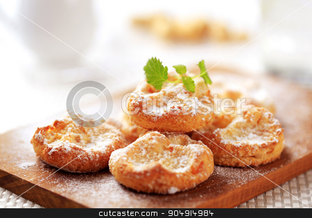 To use this stock image in your creative project, please select the size you need over to the right and click the "Add to Cart" button.
Your downloaded image will come with the Cutcaster watermark removed so don’t worry about the watermark you see on this page. Mini sweet cheese pastries stock photo, Mini cheese pastries sprinkled with icing sugar by Digifoodstock