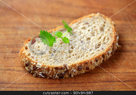 To use this stock image in your creative project, please select the size you need over to the right and click the "Add to Cart" button.
Your downloaded image will come with the Cutcaster watermark removed so don’t worry about the watermark you see on this page. Slice of whole grain bread stock photo, Slice of whole grain bread on a cutting board by Digifoodstock