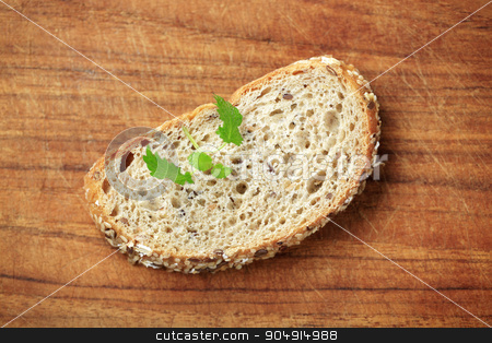 To use this stock image in your creative project, please select the size you need over to the right and click the "Add to Cart" button.
Your downloaded image will come with the Cutcaster watermark removed so don’t worry about the watermark you see on this page. Slice of whole grain bread stock photo, Slice of whole grain bread on a cutting board by Digifoodstock