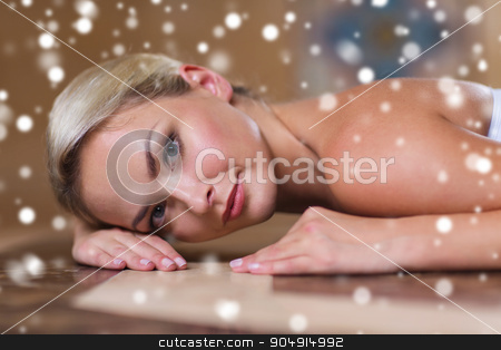 To use this stock image in your creative project, please select the size you need over to the right and click the "Add to Cart" button.
Your downloaded image will come with the Cutcaster watermark removed so don’t worry about the watermark you see on this page. young woman lying on hammam table in turkish bath stock photo, people, beauty, spa, healthy lifestyle and relaxation concept - beautiful young woman lying on hammam table in turkish bath with snow effect by Syda Productions