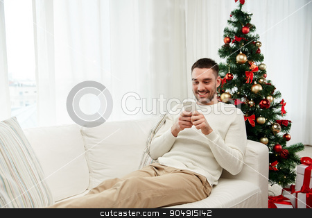 To use this stock image in your creative project, please select the size you need over to the right and click the "Add to Cart" button.
Your downloaded image will come with the Cutcaster watermark removed so don’t worry about the watermark you see on this page. smiling man with smartphone at home for christmas stock photo, christmas, technology, people and holidays concept - smiling man with smartphone texting message at home by Syda Productions