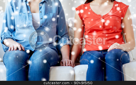 To use this stock image in your creative project, please select the size you need over to the right and click the "Add to Cart" button.
Your downloaded image will come with the Cutcaster watermark removed so don’t worry about the watermark you see on this page. close up of lesbian couple sitting on sofa at home stock photo, people, homosexuality, same-sex marriage, gay and love concept - close up of happy lesbian couple sitting on sofa at home over snow effect by Syda Productions