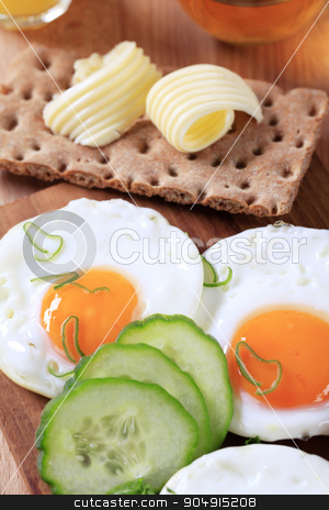 To use this stock image in your creative project, please select the size you need over to the right and click the "Add to Cart" button.
Your downloaded image will come with the Cutcaster watermark removed so don’t worry about the watermark you see on this page. Breakfast stock photo, Breakfast - Fried eggs, crisp bread and butter by Digifoodstock