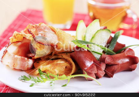 To use this stock image in your creative project, please select the size you need over to the right and click the "Add to Cart" button.
Your downloaded image will come with the Cutcaster watermark removed so don’t worry about the watermark you see on this page. Cooked breakfast stock photo, Fried egg omelet with bacon and sausages by Digifoodstock