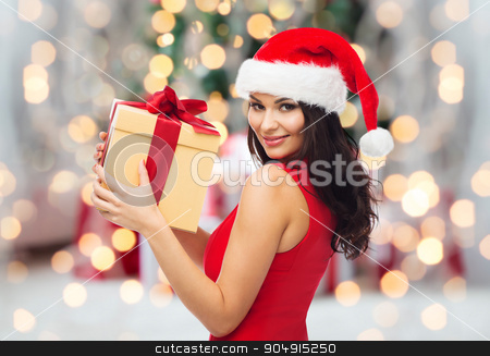 To use this stock image in your creative project, please select the size you need over to the right and click the "Add to Cart" button.
Your downloaded image will come with the Cutcaster watermark removed so don’t worry about the watermark you see on this page. beautiful sexy woman in santa hat with gift box stock photo, people, holidays, christmas and celebration concept - beautiful sexy woman in red dress and santa hat with gift box over christmas tree lights and presents background by Syda Productions