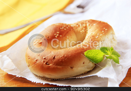 To use this stock image in your creative project, please select the size you need over to the right and click the "Add to Cart" button.
Your downloaded image will come with the Cutcaster watermark removed so don’t worry about the watermark you see on this page. Bagel stock photo, Fresh bagel with sesame seeds on top by Digifoodstock