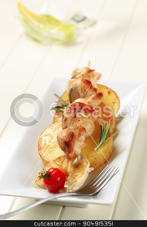To use this stock image in your creative project, please select the size you need over to the right and click the "Add to Cart" button.
Your downloaded image will come with the Cutcaster watermark removed so don’t worry about the watermark you see on this page. Chicken kebab with slices of pan roasted potato stock photo, Chicken souvlaki on slices of pan roasted potato by Digifoodstock