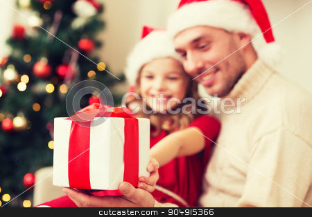 To use this stock image in your creative project, please select the size you need over to the right and click the "Add to Cart" button.
Your downloaded image will come with the Cutcaster watermark removed so don’t worry about the watermark you see on this page. close up of father and daughter with gift box stock photo, family, christmas, holidays, happiness and people concept - close up of smiling daughter giving father gift box by Syda Productions