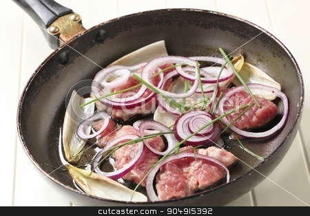 To use this stock image in your creative project, please select the size you need over to the right and click the "Add to Cart" button.
Your downloaded image will come with the Cutcaster watermark removed so don’t worry about the watermark you see on this page. Pan frying pork and onion stock photo, Raw pork, onion, and endive leaves on a frying pan by Digifoodstock