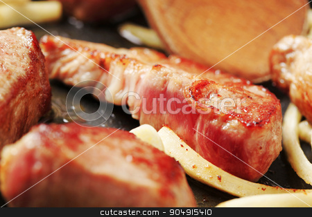 To use this stock image in your creative project, please select the size you need over to the right and click the "Add to Cart" button.
Your downloaded image will come with the Cutcaster watermark removed so don’t worry about the watermark you see on this page. Pan frying pork and garlic stock photo, Chunks of pork and garlic on a frying pan by Digifoodstock