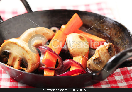 To use this stock image in your creative project, please select the size you need over to the right and click the "Add to Cart" button.
Your downloaded image will come with the Cutcaster watermark removed so don’t worry about the watermark you see on this page. Pan seared vegetables stock photo, Pan seared mushrooms, and strips of carrot by Digifoodstock