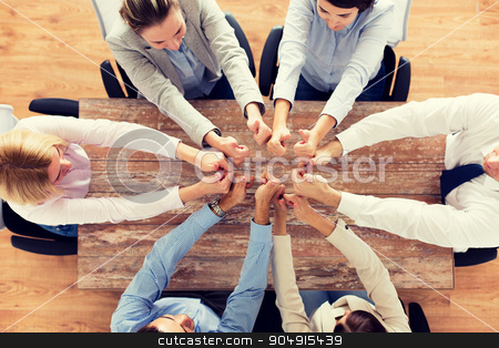 To use this stock image in your creative project, please select the size you need over to the right and click the "Add to Cart" button.
Your downloaded image will come with the Cutcaster watermark removed so don’t worry about the watermark you see on this page. business team showing thumbs up stock photo, business, people and team work concept - close up of creative team showing thumbs up and sitting at table in office by Syda Productions