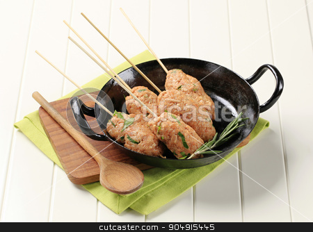 To use this stock image in your creative project, please select the size you need over to the right and click the "Add to Cart" button.
Your downloaded image will come with the Cutcaster watermark removed so don’t worry about the watermark you see on this page. Minced meat kebabs stock photo, Raw minced meat kebabs on wooden skewers by Digifoodstock