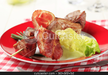 To use this stock image in your creative project, please select the size you need over to the right and click the "Add to Cart" button.
Your downloaded image will come with the Cutcaster watermark removed so don’t worry about the watermark you see on this page. Pork kebab stock photo, Pork shish kebab and rasher of bacon by Digifoodstock