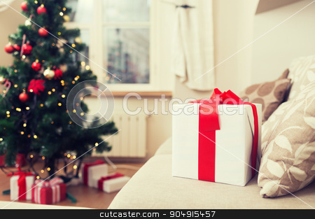 To use this stock image in your creative project, please select the size you need over to the right and click the "Add to Cart" button.
Your downloaded image will come with the Cutcaster watermark removed so don’t worry about the watermark you see on this page. gift box on coach at home stock photo, christmas, x-mas, holidays, winter and happiness concept - gift box on coach at home by Syda Productions