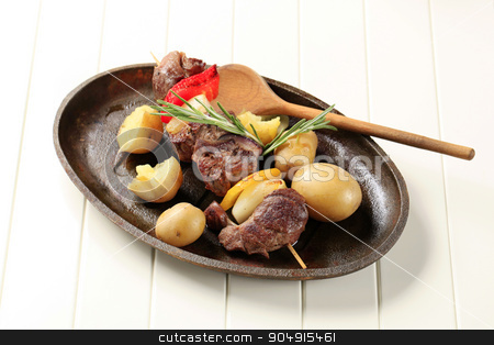 To use this stock image in your creative project, please select the size you need over to the right and click the "Add to Cart" button.
Your downloaded image will come with the Cutcaster watermark removed so don’t worry about the watermark you see on this page. Beef shish kebab stock photo, Beef shish kebab and new potatoes on cast iron plate by Digifoodstock