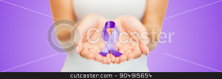 To use this stock image in your creative project, please select the size you need over to the right and click the "Add to Cart" button.
Your downloaded image will come with the Cutcaster watermark removed so don’t worry about the watermark you see on this page. close up of hands holding purple awareness ribbon stock photo, healthcare and social problems concept - close up of woman hands holding purple domestic violence awareness ribbon over violet background by Syda Productions