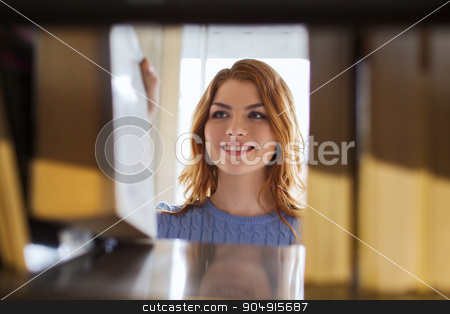 To use this stock image in your creative project, please select the size you need over to the right and click the "Add to Cart" button.
Your downloaded image will come with the Cutcaster watermark removed so don’t worry about the watermark you see on this page. happy student girl or woman with book in library stock photo, people, knowledge, education and school concept - happy student girl or young woman taking book from shelf in library by Syda Productions