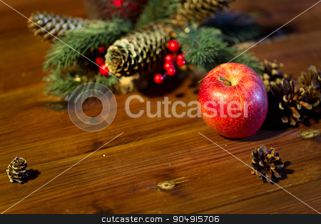 To use this stock image in your creative project, please select the size you need over to the right and click the "Add to Cart" button.
Your downloaded image will come with the Cutcaster watermark removed so don’t worry about the watermark you see on this page. close up of apple with fir decoration on wood stock photo, christmas, decoration, holidays and new year concept - close up of red apple with fir branch decoration on wooden table by Syda Productions