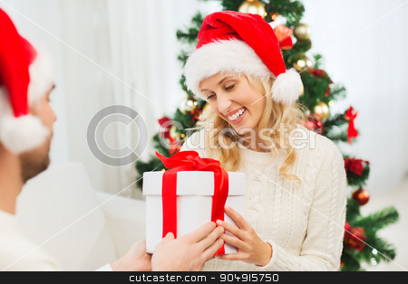 To use this stock image in your creative project, please select the size you need over to the right and click the "Add to Cart" button.
Your downloaded image will come with the Cutcaster watermark removed so don’t worry about the watermark you see on this page. happy couple at home with christmas gift box stock photo, christmas, holidays and people concept - happy couple in santa hats with gift box sitting on sofa at home by Syda Productions