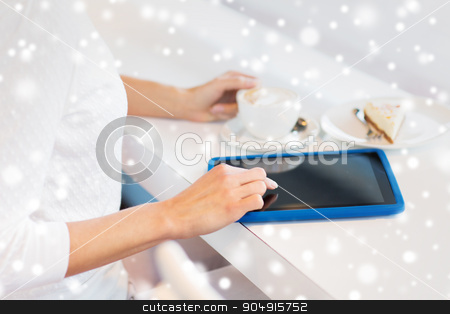 To use this stock image in your creative project, please select the size you need over to the right and click the "Add to Cart" button.
Your downloaded image will come with the Cutcaster watermark removed so don’t worry about the watermark you see on this page. close up of woman with tablet pc drinking coffee stock photo, leisure, people, technology, holidays and lifestyle concept - close up of young woman hands with tablet pc computer drinking coffee and eating cake at cafe over snow effect by Syda Productions