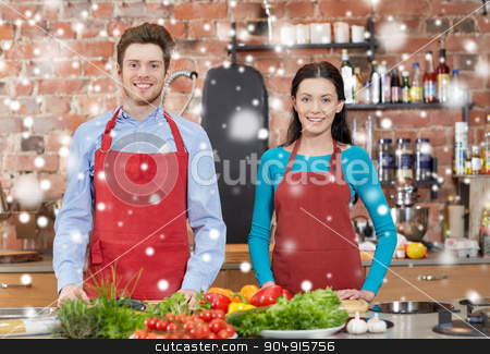 To use this stock image in your creative project, please select the size you need over to the right and click the "Add to Cart" button.
Your downloaded image will come with the Cutcaster watermark removed so don’t worry about the watermark you see on this page. happy couple in kitchen at cooking class stock photo, cooking class, culinary, food and people concept - happy couple in kitchen over snow effect by Syda Productions
