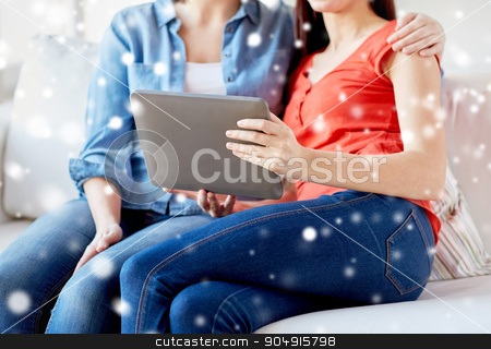 To use this stock image in your creative project, please select the size you need over to the right and click the "Add to Cart" button.
Your downloaded image will come with the Cutcaster watermark removed so don’t worry about the watermark you see on this page. close up of lesbian couple with tablet pc at home stock photo, people, homosexuality, same-sex marriage, gay and love concept - close up of happy lesbian couple with tablet pc computer sitting on sofa at home over snow effect by Syda Productions