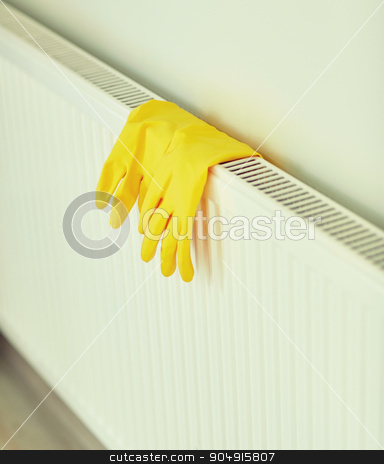 To use this stock image in your creative project, please select the size you need over to the right and click the "Add to Cart" button.
Your downloaded image will come with the Cutcaster watermark removed so don’t worry about the watermark you see on this page. close up of rubber gloves hanging on heater stock photo, protection, housework and housekeeping concept - close up of yellow rubber gloves hanging on heater at home by Syda Productions