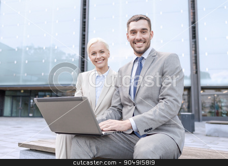 To use this stock image in your creative project, please select the size you need over to the right and click the "Add to Cart" button.
Your downloaded image will come with the Cutcaster watermark removed so don’t worry about the watermark you see on this page. smiling businesspeople with laptop outdoors stock photo, business, education, technology and people concept - smiling businesspeople working with laptop computer on city street by Syda Productions