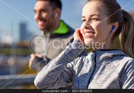 To use this stock image in your creative project, please select the size you need over to the right and click the "Add to Cart" button.
Your downloaded image will come with the Cutcaster watermark removed so don’t worry about the watermark you see on this page. happy couple with earphones running in city stock photo, fitness, sport, people, technology and lifestyle concept - happy couple running and listening to music in earphones at city by Syda Productions