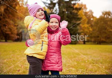 To use this stock image in your creative project, please select the size you need over to the right and click the "Add to Cart" button.
Your downloaded image will come with the Cutcaster watermark removed so don’t worry about the watermark you see on this page. happy little girls waving hands in autumn park stock photo, autumn, childhood, leisure, gesture and people concept - happy little girls waving hands in park outdoors by Syda Productions