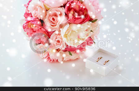 To use this stock image in your creative project, please select the size you need over to the right and click the "Add to Cart" button.
Your downloaded image will come with the Cutcaster watermark removed so don’t worry about the watermark you see on this page. close up of gay wedding rings and flower bunch stock photo, people, homosexuality, same-sex marriage and love concept - close up of gay female wedding rings in little box and flower bunch on table over snow effect by Syda Productions