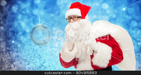 To use this stock image in your creative project, please select the size you need over to the right and click the "Add to Cart" button.
Your downloaded image will come with the Cutcaster watermark removed so don’t worry about the watermark you see on this page. man in costume of santa claus with bag stock photo, christmas, holidays and people concept - man in costume of santa claus with bag making hush gesture over blue glitter or lights background by Syda Productions