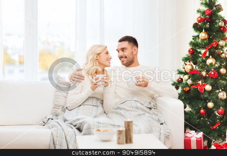 To use this stock image in your creative project, please select the size you need over to the right and click the "Add to Cart" button.
Your downloaded image will come with the Cutcaster watermark removed so don’t worry about the watermark you see on this page. happy couple at home with christmas tree stock photo, family, christmas, holidays, love and people concept - happy couple covered with plaid drinking tea and sitting on sofa at home by Syda Productions