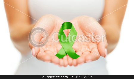 To use this stock image in your creative project, please select the size you need over to the right and click the "Add to Cart" button.
Your downloaded image will come with the Cutcaster watermark removed so don’t worry about the watermark you see on this page. hands holding green awareness ribbon stock photo, healthcare and medicine concept - female hands holding green organ transplant awareness ribbon by Syda Productions